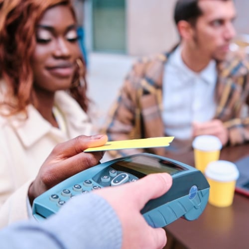 close-up-view-of-a-woman-making-contactless-paymen-2023-11-27-05-34-43-utc