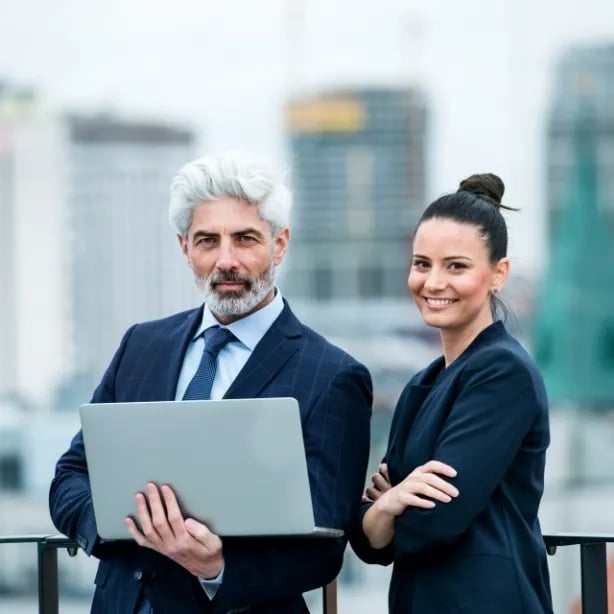 a-businessman-and-businesswoman-with-laptop-stand